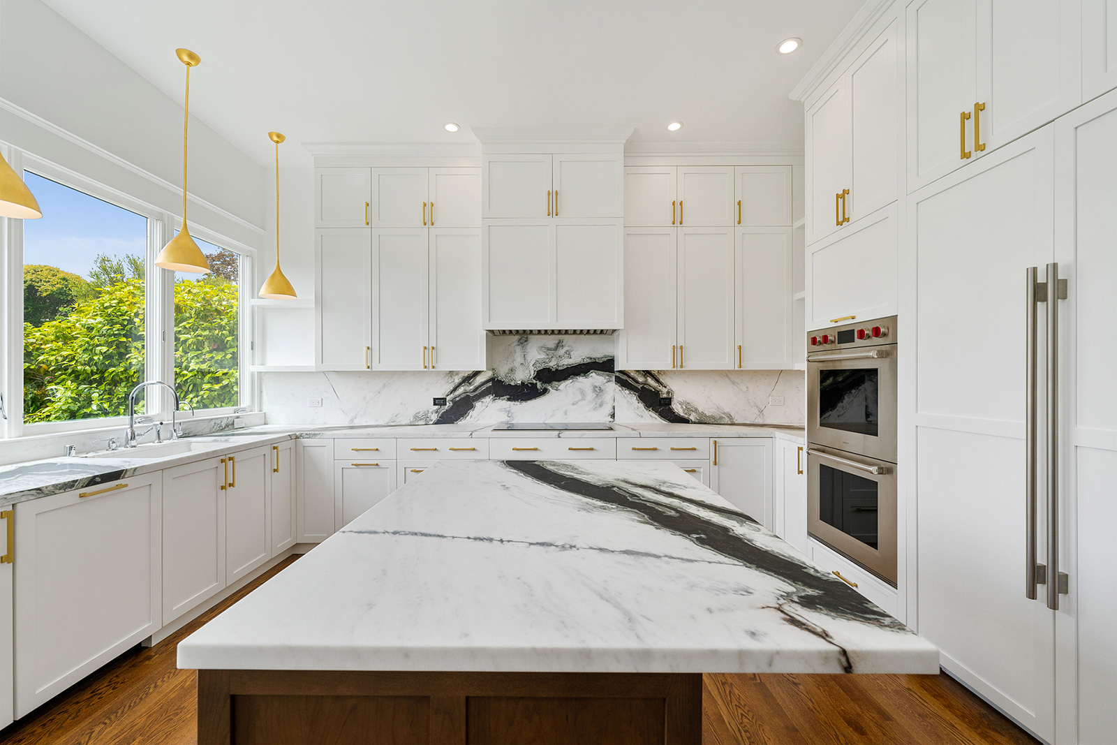 White kitchen with marble countertops